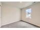 A carpeted bedroom featuring neutral walls and a window with exterior views at 523 Beckwourth Ave, Fort Lupton, CO 80621
