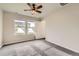 Bedroom featuring neutral paint, carpet, ceiling fan and a window for ample natural light at 523 Beckwourth Ave, Fort Lupton, CO 80621