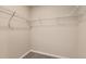 A walk-in closet featuring carpeted floors and a wall-mounted chrome wire shelving system at 523 Beckwourth Ave, Fort Lupton, CO 80621