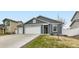 Charming home with a two-car garage, lush lawn, and classic design at 523 Beckwourth Ave, Fort Lupton, CO 80621