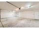 Clean, unfinished garage with concrete floor and overhead lighting at 523 Beckwourth Ave, Fort Lupton, CO 80621