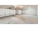 Spacious three car garage with high ceilings and multiple doors at 523 Beckwourth Ave, Fort Lupton, CO 80621