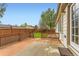 Outdoor deck area with wood railings and access to backyard, perfect for outdoor relaxation at 741 Hallmark Ln, Longmont, CO 80504