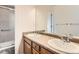 Bathroom featuring double sinks with lots of counter space and a shower at 741 Hallmark Ln, Longmont, CO 80504