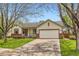 Charming single-story home featuring a two-car garage, well-maintained lawn, and inviting curb appeal at 741 Hallmark Ln, Longmont, CO 80504