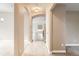 Bright hallway with neutral paint, tile flooring and views to other rooms at 741 Hallmark Ln, Longmont, CO 80504