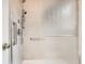 Accessible shower with grab bars and a frosted shower door at 741 Hallmark Ln, Longmont, CO 80504