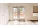 Sun room featuring lots of natural light, tile floors, and backyard access at 741 Hallmark Ln, Longmont, CO 80504