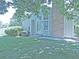 Charming home exterior featuring a well-maintained lawn and inviting entrance and brickwork at 9669 W Chatfield Ave # A, Littleton, CO 80128