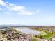 Aerial view overlooking neighborhood with lake at 1581 King St, Denver, CO 80204