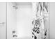 Shower features white subway tile and a decorative shower curtain at 1581 King St, Denver, CO 80204