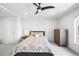 Inviting bedroom with neutral decor, a ceiling fan, and a comfortable queen-sized bed, ensuring a relaxing retreat at 1581 King St, Denver, CO 80204