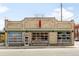 Exterior view of a brick building featuring a modern and inviting storefront at 1581 King St, Denver, CO 80204