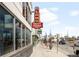 Exterior view of a building featuring a vintage-style sign with a reflection in the windows at 1581 King St, Denver, CO 80204