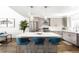 Bright kitchen with stainless steel appliances, island with barstool seating at 1581 King St, Denver, CO 80204