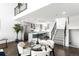 Open-concept living space features modern kitchen, dining area, and staircase at 1581 King St, Denver, CO 80204