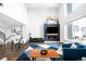 Bright, open living room boasts fireplace feature wall and modern furnishings at 1581 King St, Denver, CO 80204
