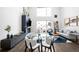 Open concept living area combines dining and living spaces with fireplace at 1581 King St, Denver, CO 80204
