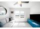 Bright living room featuring a large window, sofa, and modern decor at 1581 King St, Denver, CO 80204