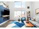 Comfortable living room with fireplace, natural light, and modern decor at 1581 King St, Denver, CO 80204