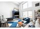 Cozy living room with fireplace and large windows offering ample natural light at 1581 King St, Denver, CO 80204