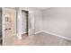 This empty bedroom features wood-look flooring, fresh paint, and a mirrored closet at 16359 W 10Th Ave # T1, Golden, CO 80401