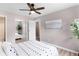 This bedroom features a neutral color palette, a ceiling fan, and an ensuite bathroom at 16359 W 10Th Ave # T1, Golden, CO 80401