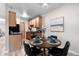 Inviting dining space with round table, seating for four, and a view of the kitchen area at 16359 W 10Th Ave # T1, Golden, CO 80401