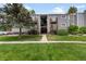 Apartment exterior has well maintained landscaping and shared stairs at 16359 W 10Th Ave # T1, Golden, CO 80401