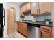 Updated kitchen with stainless steel appliances and light-colored cabinets at 16359 W 10Th Ave # T1, Golden, CO 80401