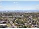 Expansive aerial view showcasing the city skyline, lush greenery, and surrounding neighborhoods at 2433 E 90Th Ave, Thornton, CO 80229