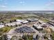 Aerial view featuring the school, with parking, sports fields, play areas, and landscaping at 2433 E 90Th Ave, Thornton, CO 80229