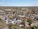 Aerial view featuring a developed residential area, with green spaces and landscaping at 2433 E 90Th Ave, Thornton, CO 80229