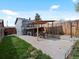 Backyard featuring a covered patio area perfect for outdoor dining and relaxing with a fenced yard at 2433 E 90Th Ave, Thornton, CO 80229