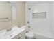 The bathroom features white tile and modern fixtures for a clean and contemporary feel at 2433 E 90Th Ave, Thornton, CO 80229