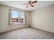 Inviting bedroom with ceiling fan and neutral carpet offers a relaxing ambiance at 2433 E 90Th Ave, Thornton, CO 80229