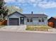 Charming single-story home featuring a well-kept front yard, garage, and inviting entrance at 2433 E 90Th Ave, Thornton, CO 80229