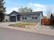 Charming single-story home with a garage, well-kept yard, and a wooden gate offering privacy at 2433 E 90Th Ave, Thornton, CO 80229