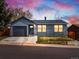 Charming single-story home with gray siding, attached garage, and well-manicured lawn on a well-lit street at 2433 E 90Th Ave, Thornton, CO 80229