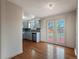 Modern kitchen featuring stainless steel appliances, gray cabinets, and seamless access to the backyard at 2433 E 90Th Ave, Thornton, CO 80229
