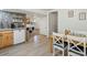 Open kitchen design with modern appliances, sleek cabinetry, and ample dining space, ideal for entertaining at 2433 E 90Th Ave, Thornton, CO 80229