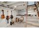 Finished basement with painted brick walls and wooden stairs, perfect for recreation or hobbies at 2445 N Franklin St, Denver, CO 80205