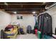Unfinished basement storage area with exposed ceiling, a small window, and space for organization at 2445 N Franklin St, Denver, CO 80205