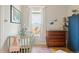 Charming Bedroom featuring a crib, a wooden dresser, and an interesting nautical theme at 2445 N Franklin St, Denver, CO 80205