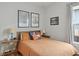 Comfortable bedroom with hardwood floors, natural light, and cozy decor. Ansel Adams prints displayed at 2445 N Franklin St, Denver, CO 80205