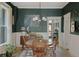 Elegant dining room with dark accent walls, a round table, and stylish lighting at 2445 N Franklin St, Denver, CO 80205