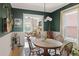 Inviting dining room with views into the living room, stylish decor, and natural light at 2445 N Franklin St, Denver, CO 80205