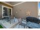 Outdoor patio with a grill and outdoor furniture, creating a cozy entertainment space at 9675 E 105Th Ave, Commerce City, CO 80640