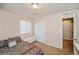 Cozy bedroom features natural light, neutral walls, carpeted floor and a closet at 9675 E 105Th Ave, Commerce City, CO 80640