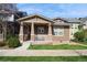 Charming single-Gathering home featuring a cozy front porch and manicured lawn in a friendly neighborhood at 9675 E 105Th Ave, Commerce City, CO 80640